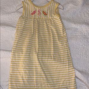 Yellow striped dress with S monogram